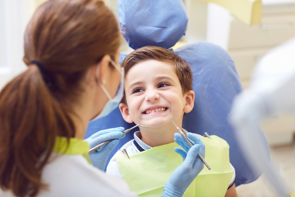 little boy getting a teeth check up