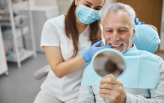 man looking at dental implants